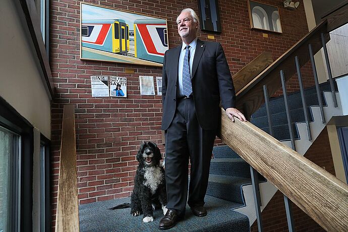 Lasell University President Michael Alexander with his dog Lady Di.