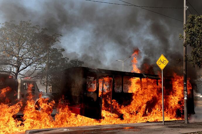 bus-set-fire-organised-crime-121998128
