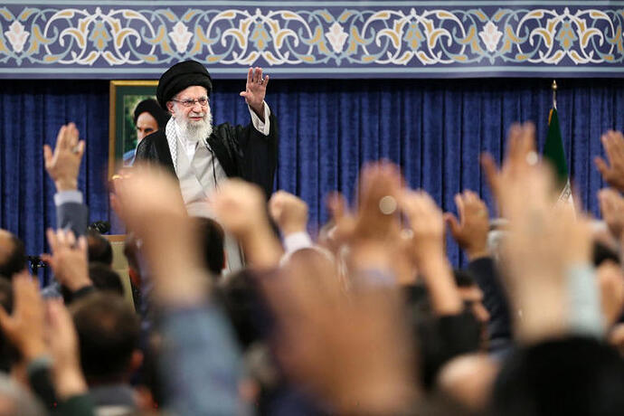 A handout picture provided by Iranian Supreme Leader Ayatollah Ali Khamenei’s office shows him greeting a crowd. KHAMENEI.IR/AFP via Getty Images