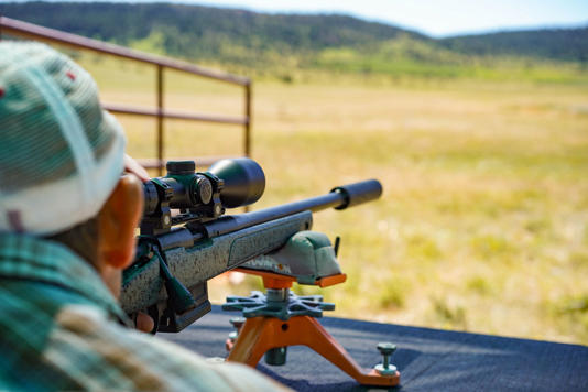 The author testing budget rifle scopes at the range. Scott Einsmann The author testing budget rifle scopes at the range. Scott Einsmann