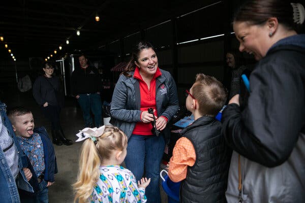 Jacqueline M. Nolting smiles as she talkes to kids and parents near an entrance to the fair.