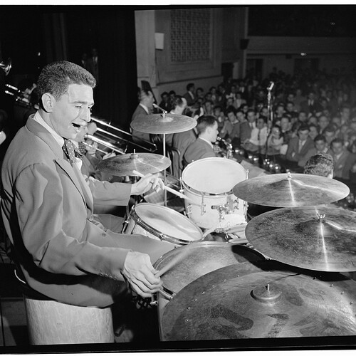 May be an image of 2 people and cymbal