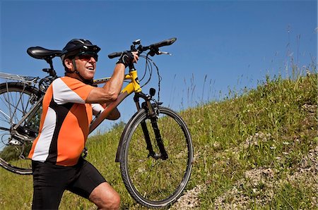 Man carrying bike