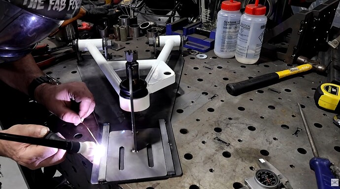 custom fabricated fixture to make foxbody mustang a-arms